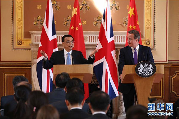     6月17日，國務院總理李克強同英國首相卡梅倫在倫敦舉行中英總理年度會晤后共同會見記者。 新華社記者 龐興雷 攝 